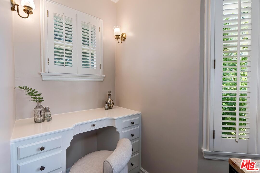 929 Mesa Verde Road Pasadena, CA 91105 - Photo 19 of 51 a bathroom with a sink a vanity and a window