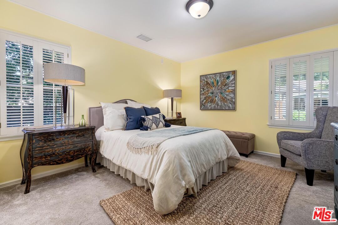 929 Mesa Verde Road Pasadena, CA 91105 - Photo 21 of 51 a bedroom with a bed and a couch