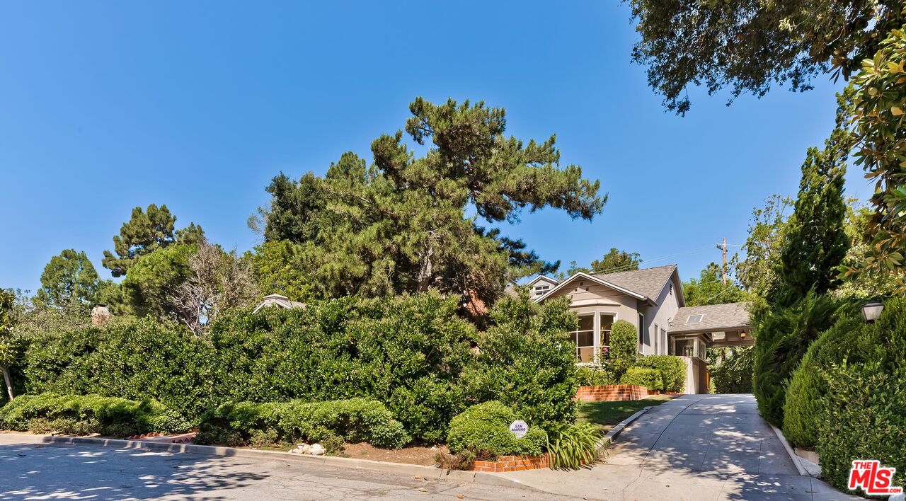 929 Mesa Verde Road Pasadena, CA 91105 - Photo 3 of 51 a front view of a house with a yard