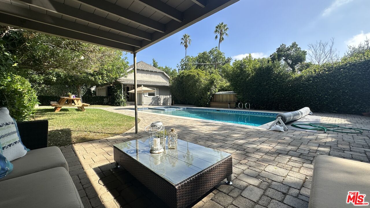 929 Mesa Verde Road Pasadena, CA 91105 - Photo 40 of 51 a view of a patio with a table chairs and a patio