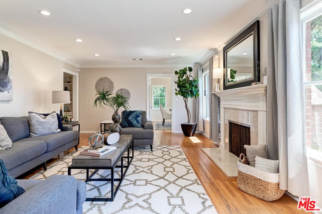929 Mesa Verde Road Pasadena, CA 91105 - Photo 9 of 51 a living room with furniture and a fireplace