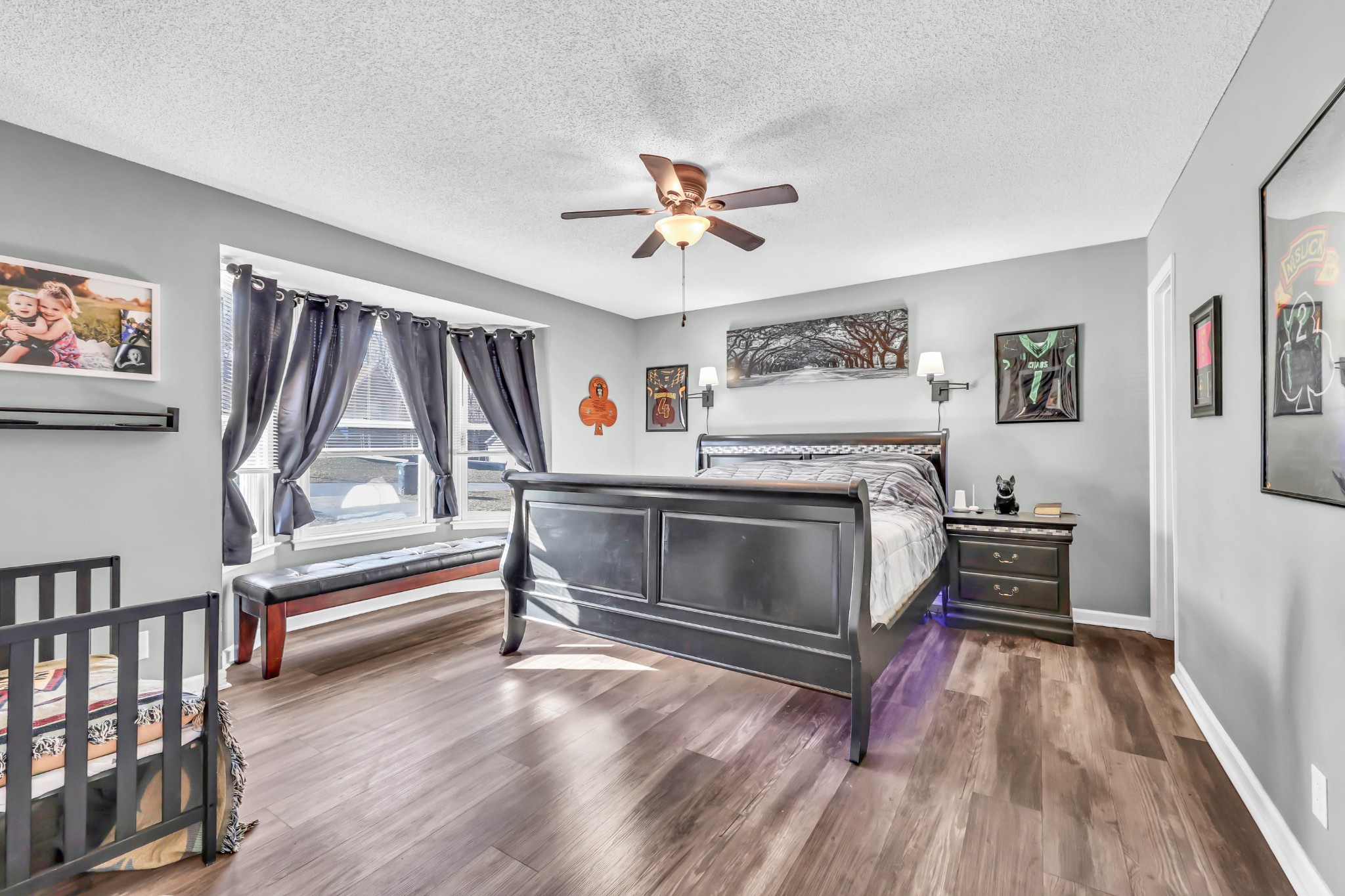 1440 McClardy Road Clarksville, TN 37042 - Photo 13 of 33 a living room with wooden floor and a ceiling fan