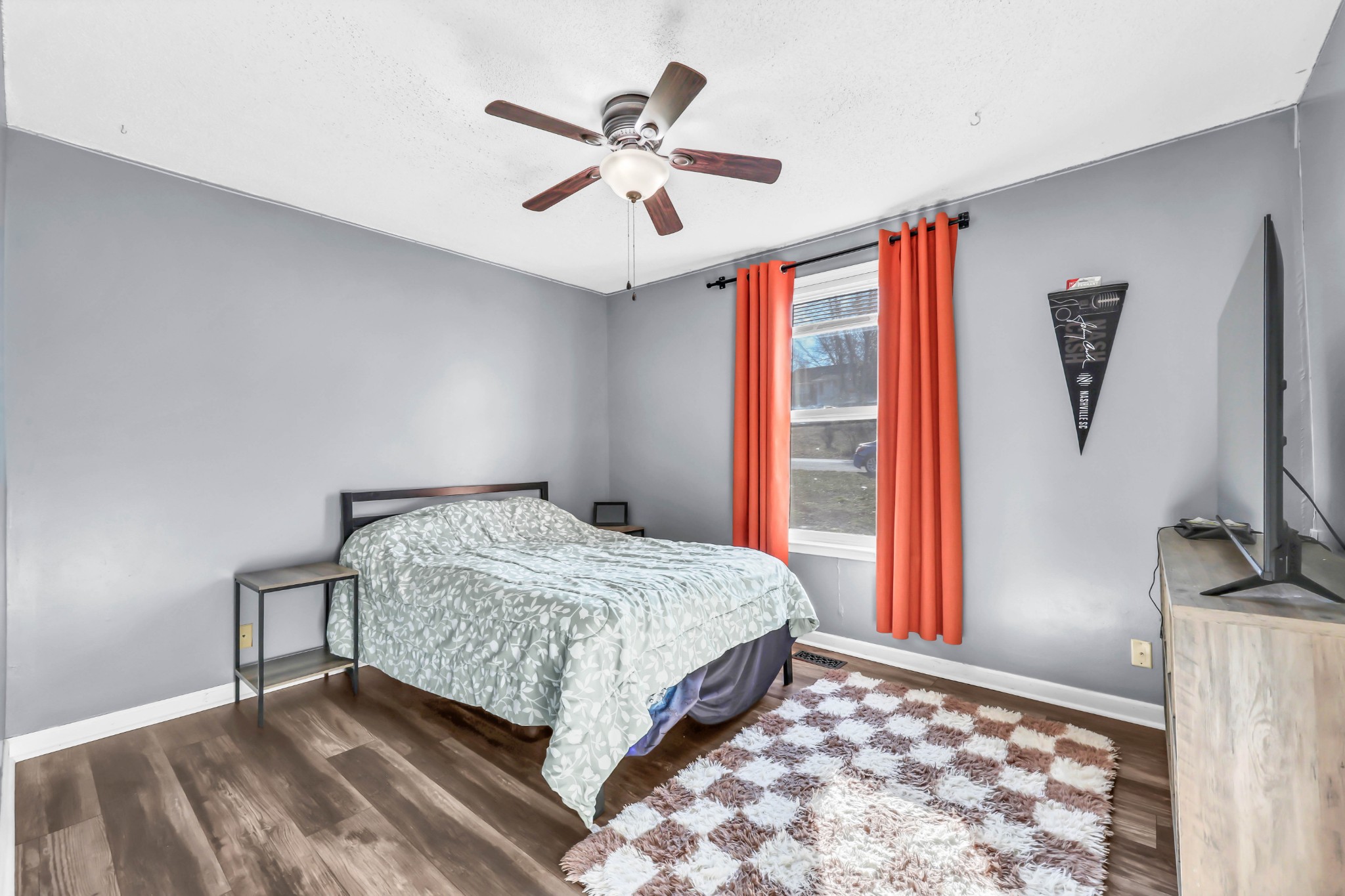 1440 McClardy Road Clarksville, TN 37042 - Photo 17 of 33 a bedroom with a bed and a flat screen tv