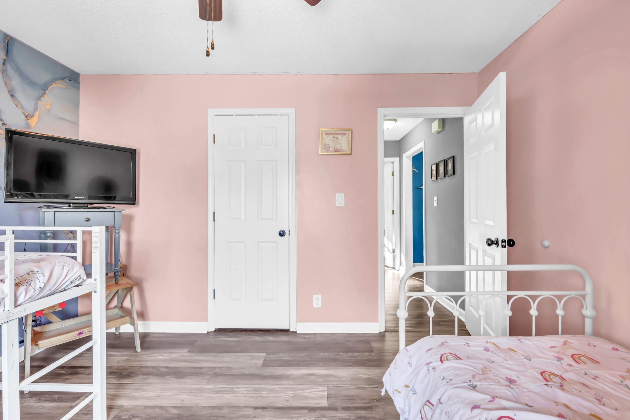 1440 McClardy Road Clarksville, TN 37042 - Photo 19 of 33 a bedroom with a bed and a flat screen tv