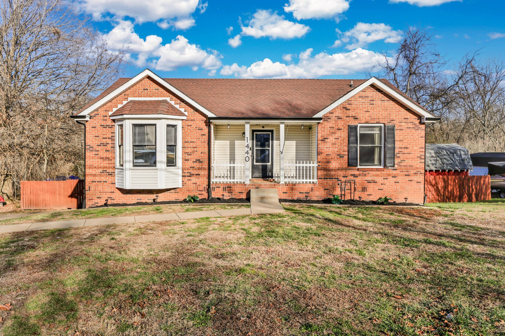 1440 McClardy Road Clarksville, TN 37042 - Photo 2 of 33 a front view of a house with a yard and garage