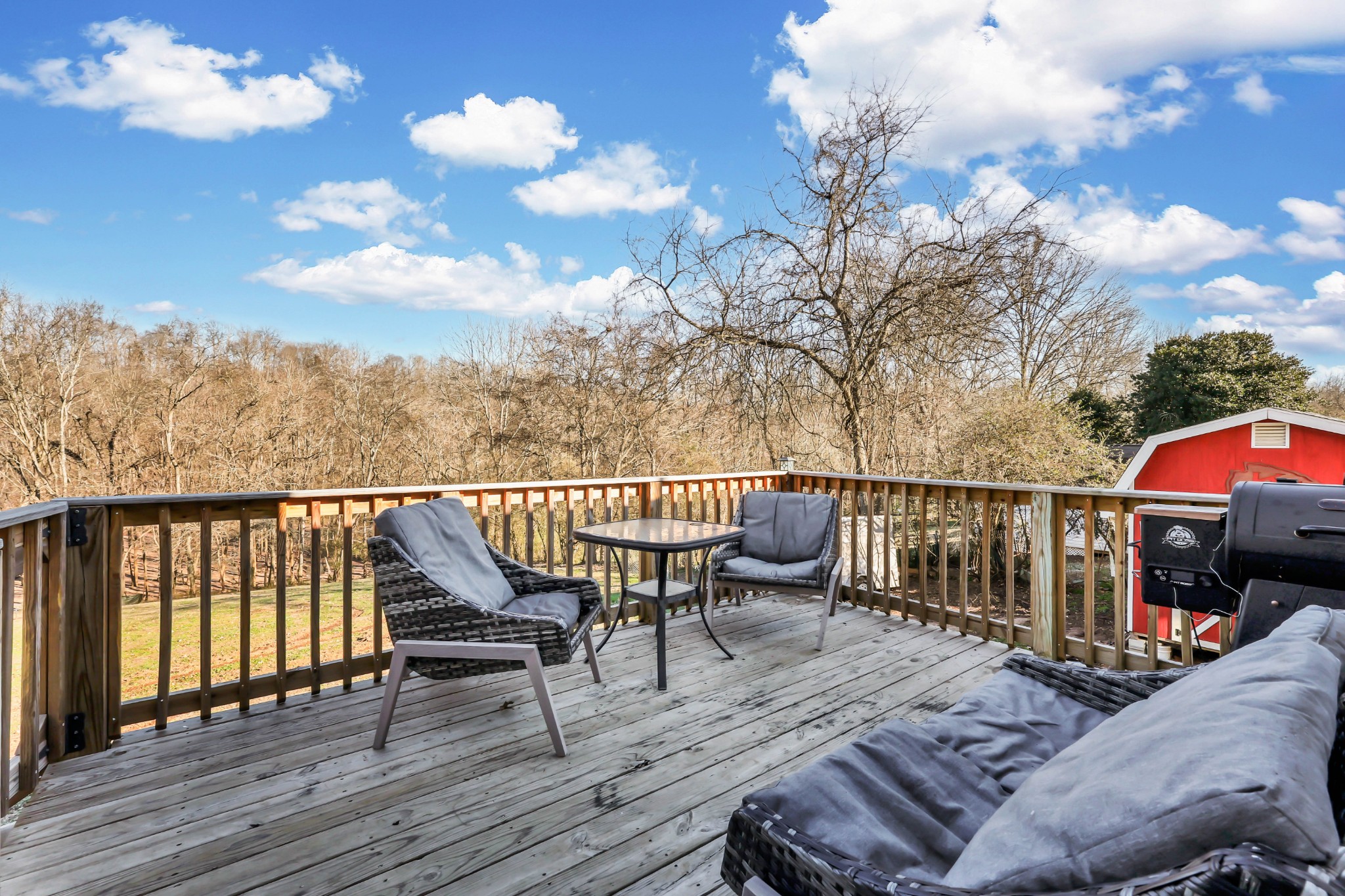 1440 McClardy Road Clarksville, TN 37042 - Photo 25 of 33 a view of balcony with wooden floor and outdoor seating