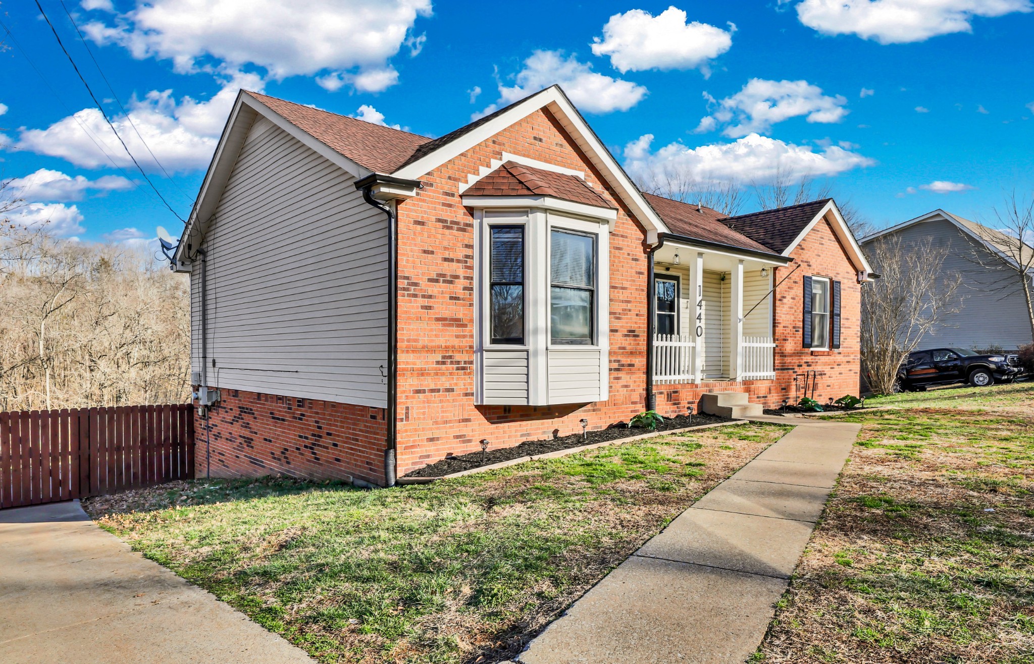1440 McClardy Road Clarksville, TN 37042 - Photo 3 of 33 a front view of a house with a garden