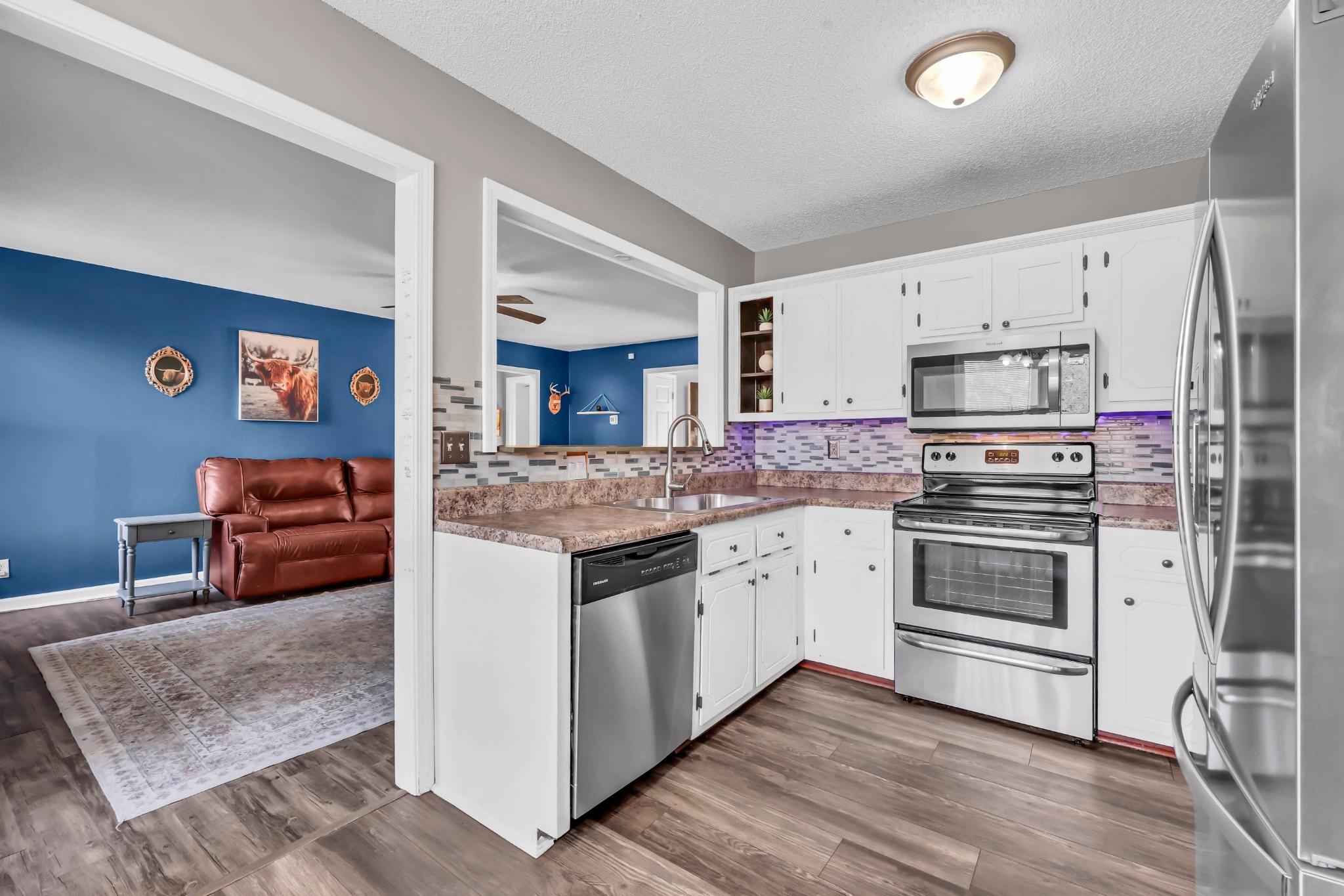 1440 McClardy Road Clarksville, TN 37042 - Photo 9 of 33 a kitchen with stainless steel appliances granite countertop a stove and a sink