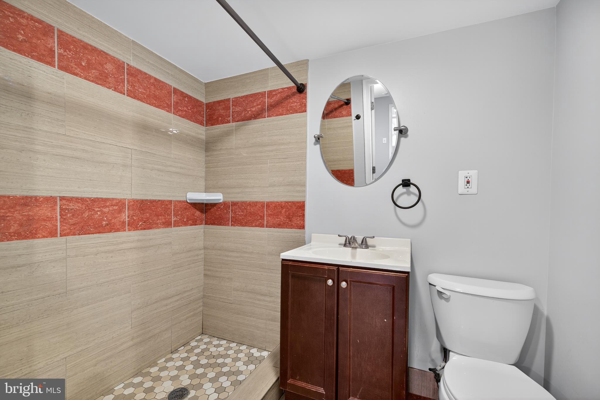 9961 Lake Landing Road Gaithersburg, MD 20886 - Photo 22 of 40 a bathroom with a toilet sink vanity and mirror