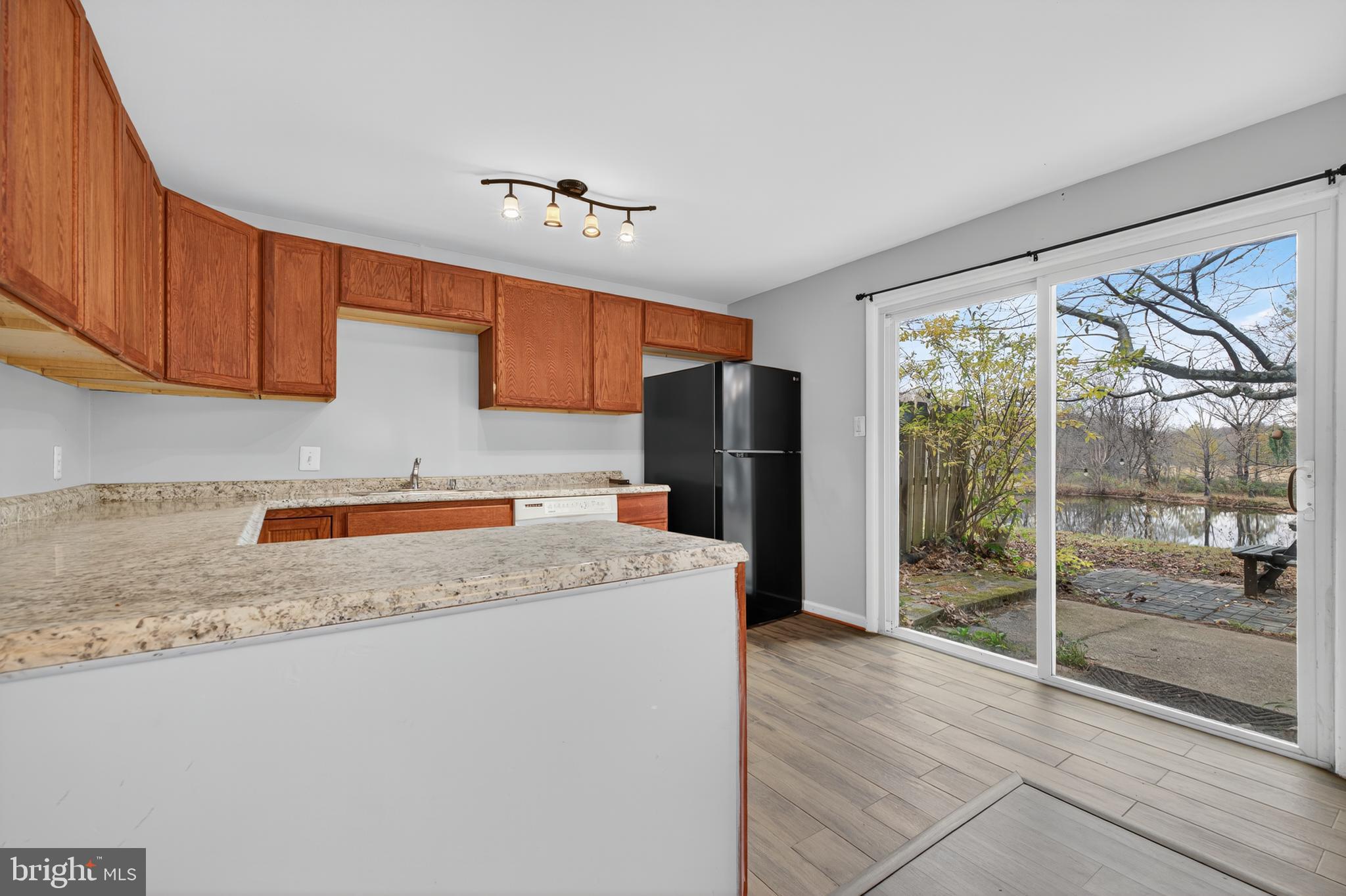 9961 Lake Landing Road Gaithersburg, MD 20886 - Photo 25 of 40 a kitchen with refrigerator and window
