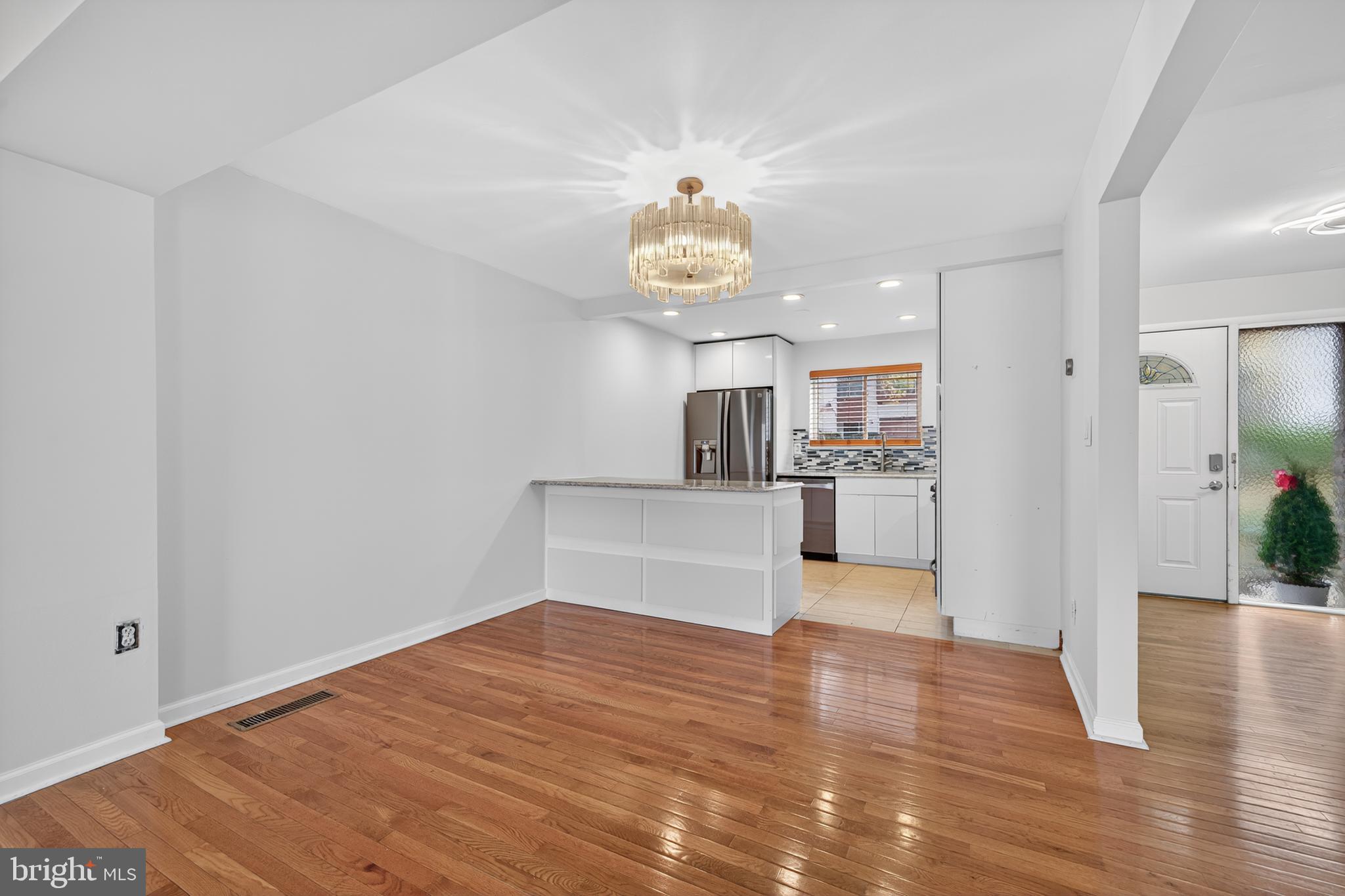 9961 Lake Landing Road Gaithersburg, MD 20886 - Photo 8 of 40 a view of a kitchen with wooden floor and a kitchen
