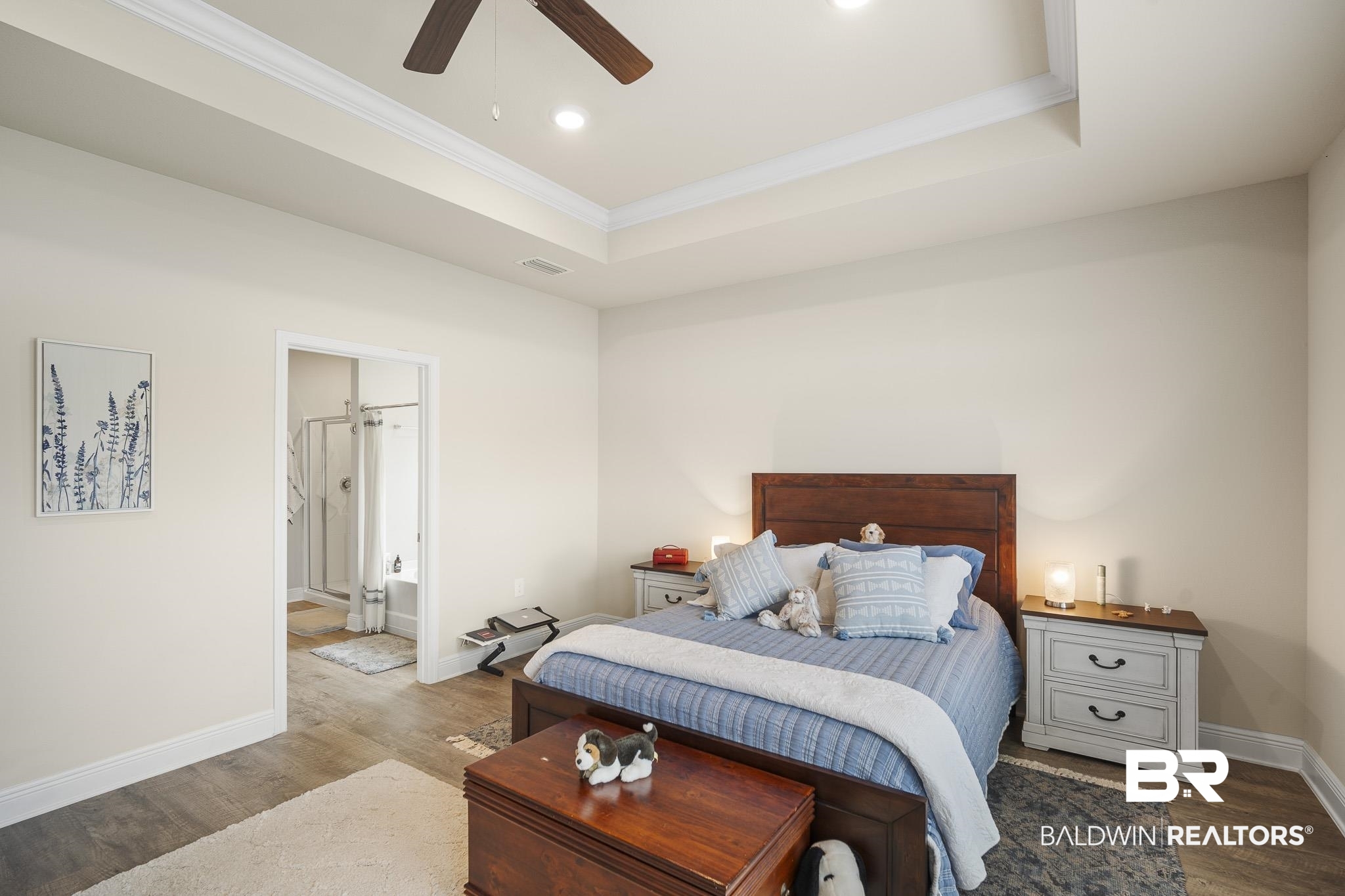24765 Spectacular Bid Loop Daphne, AL 36526 - Photo 25 of 45 Bedroom with hardwood / wood-style floors, ensuite bath, a raised ceiling, and ceiling fan