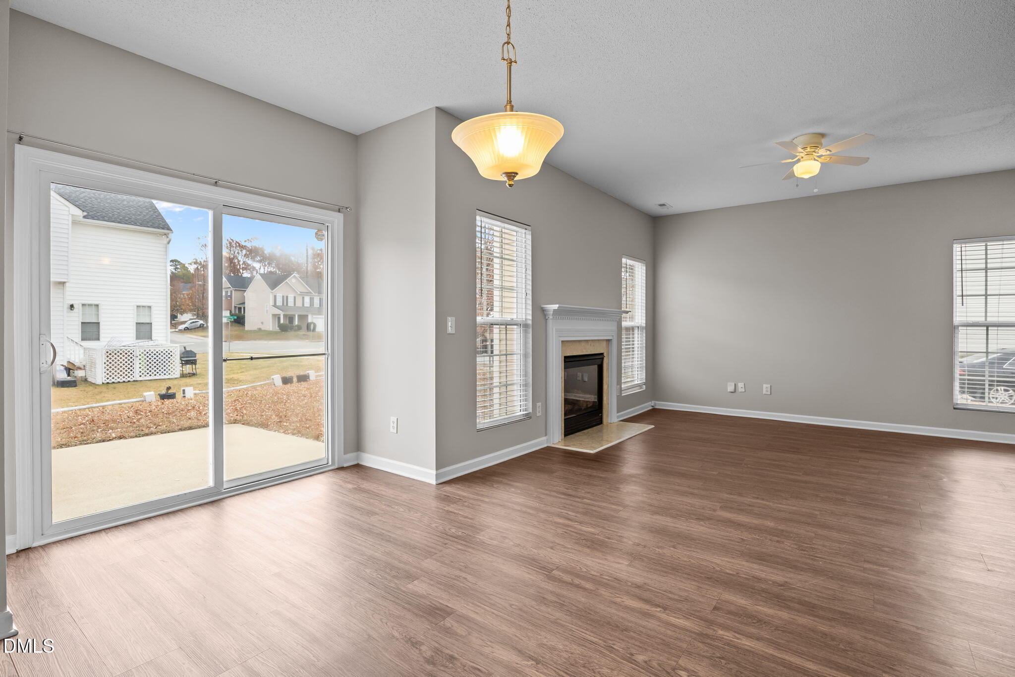 4406 Snowcrest Lane Raleigh, NC 27616 - Photo 11 of 41 a view of an empty room with window and wooden floor