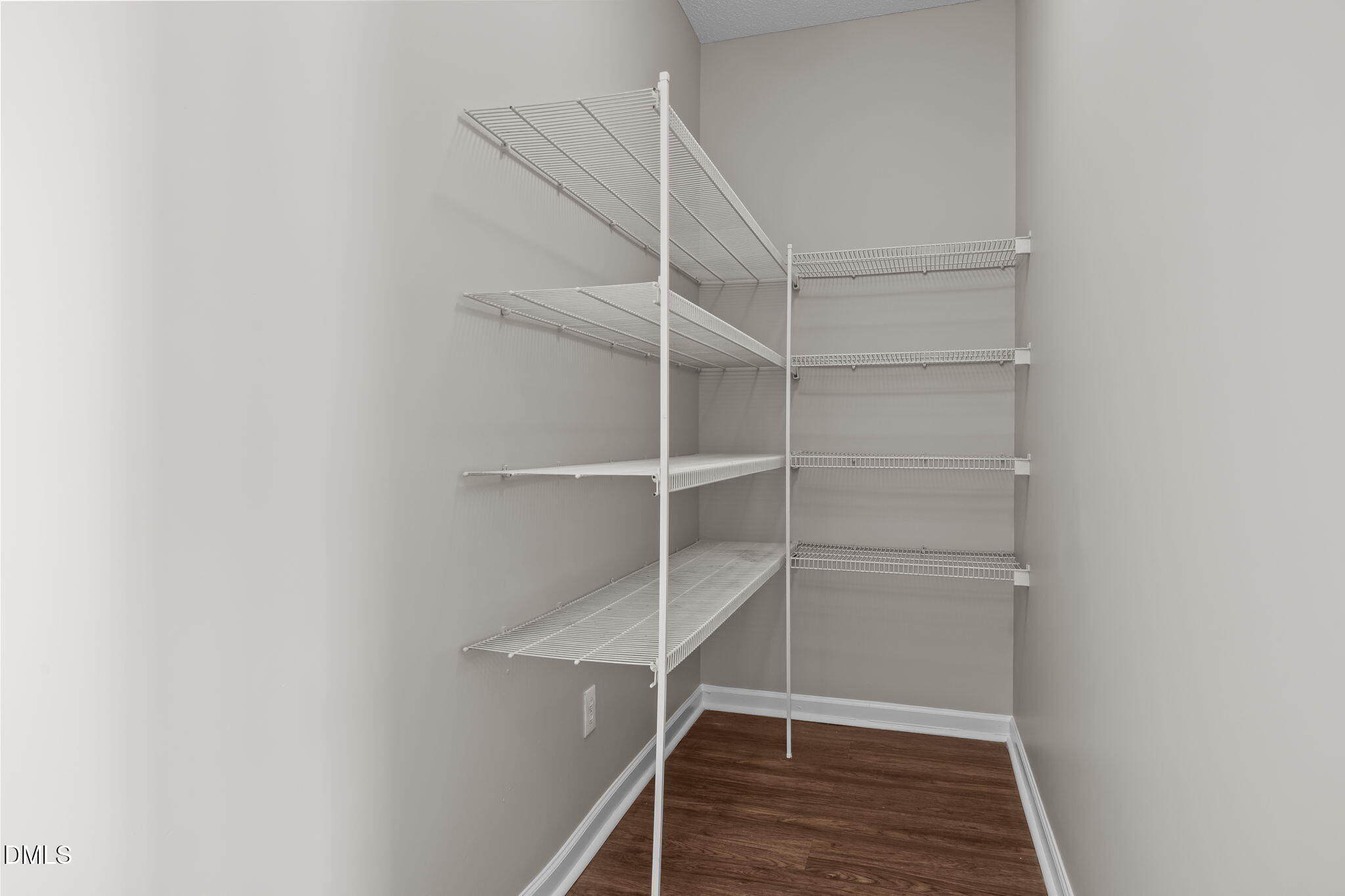 4406 Snowcrest Lane Raleigh, NC 27616 - Photo 15 of 41 a view of walk in closet with empty racks
