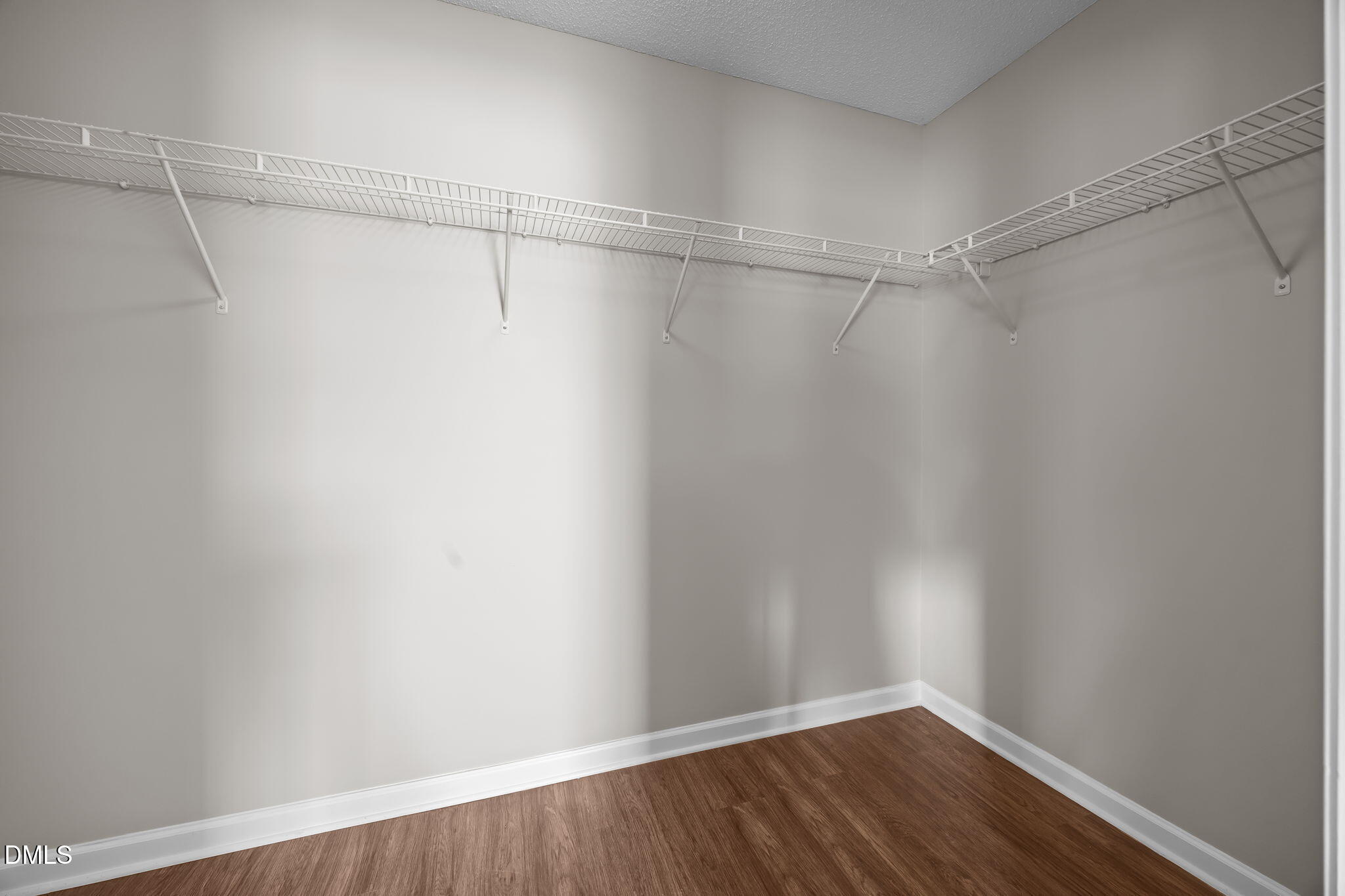 4406 Snowcrest Lane Raleigh, NC 27616 - Photo 18 of 41 a view of a room with racks on the wall