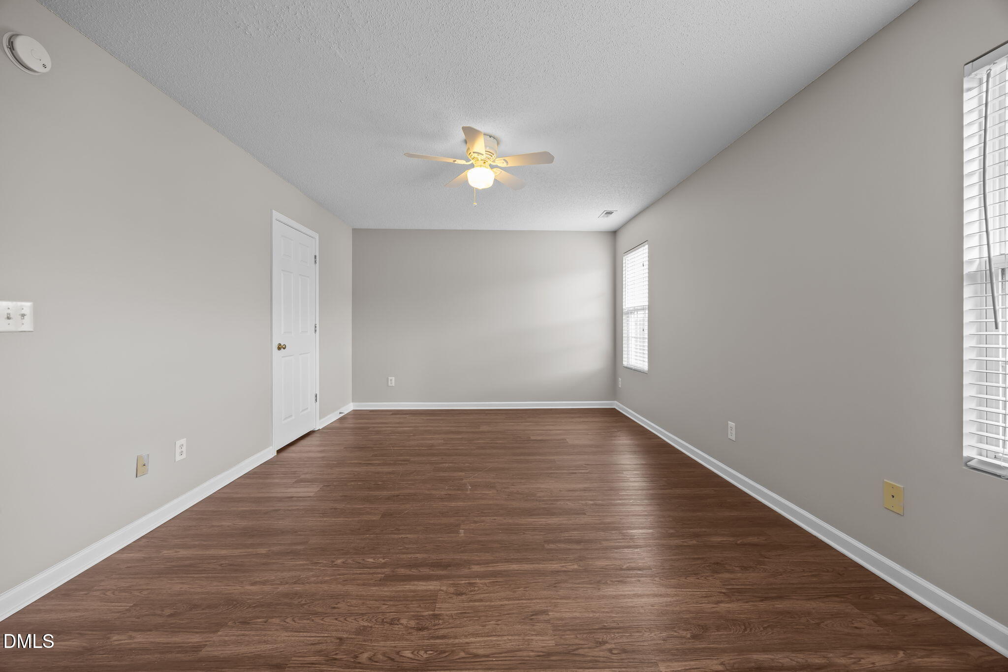 4406 Snowcrest Lane Raleigh, NC 27616 - Photo 19 of 41 wooden floor in an empty room with a window