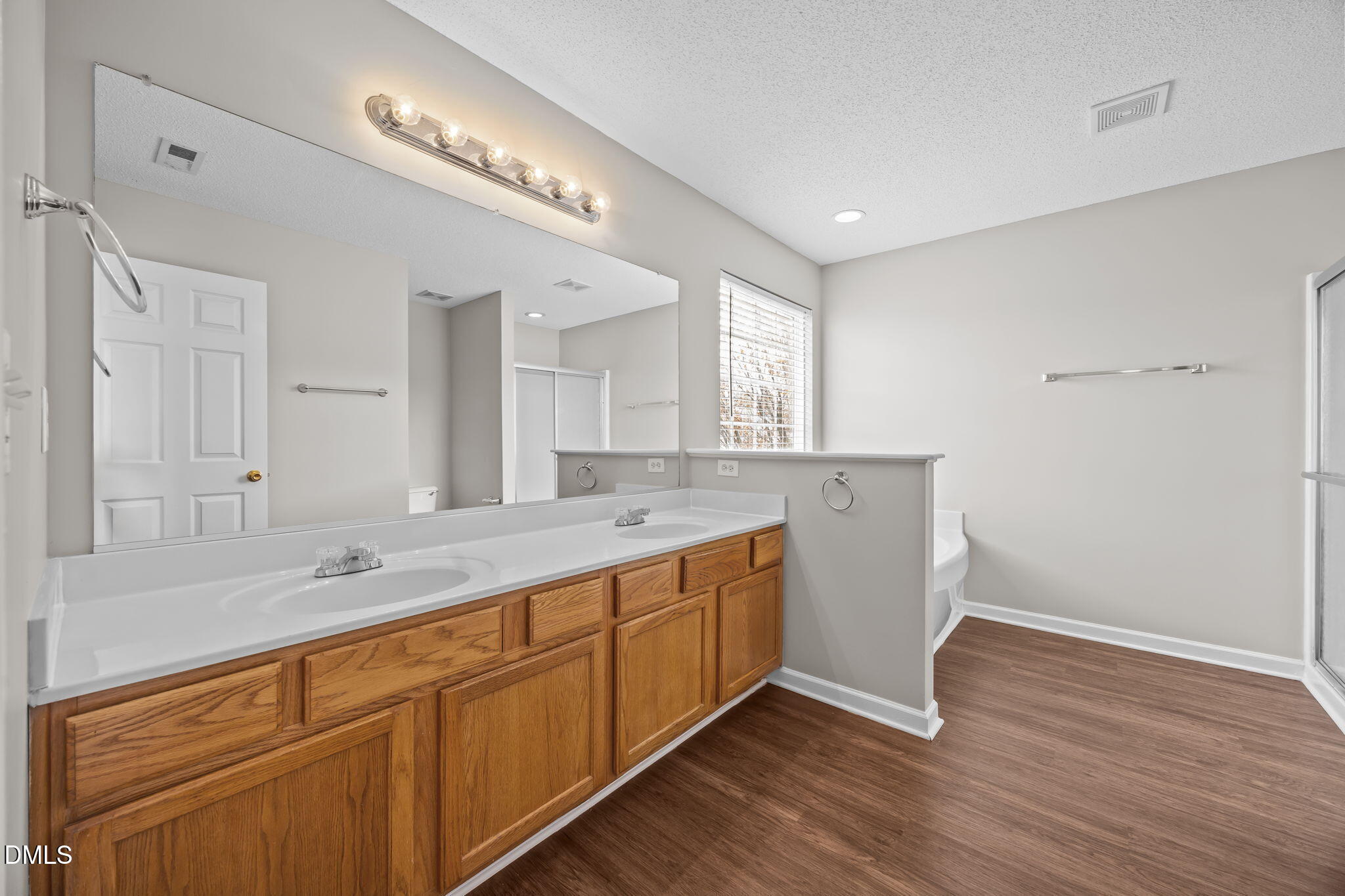 4406 Snowcrest Lane Raleigh, NC 27616 - Photo 20 of 41 a bathroom with a sink and a mirror