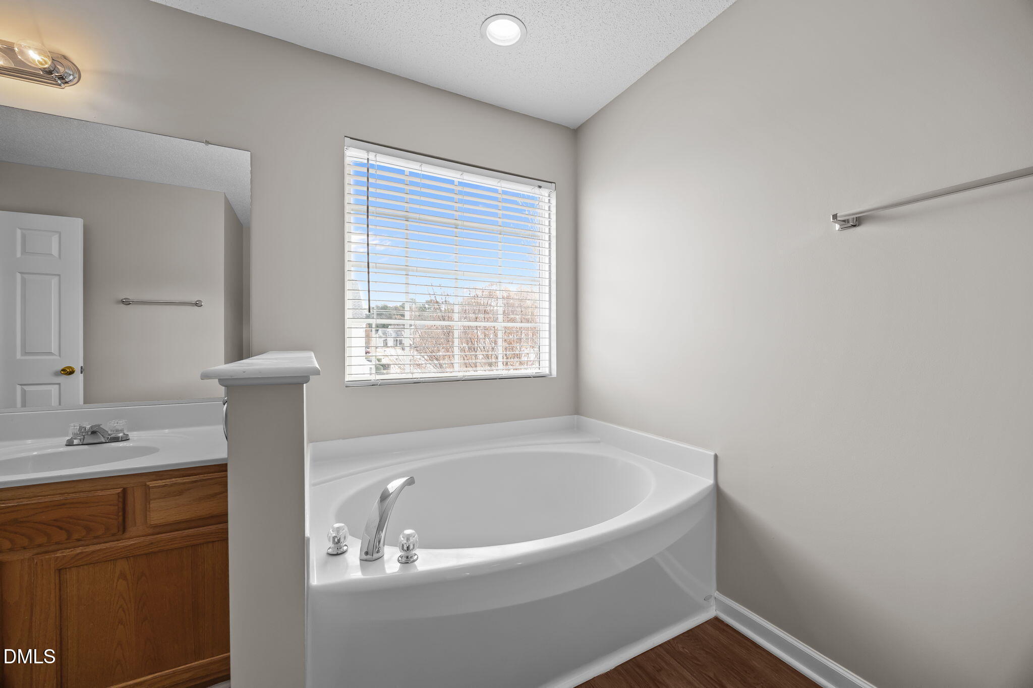4406 Snowcrest Lane Raleigh, NC 27616 - Photo 21 of 41 a white bath tub sitting next to a white sink