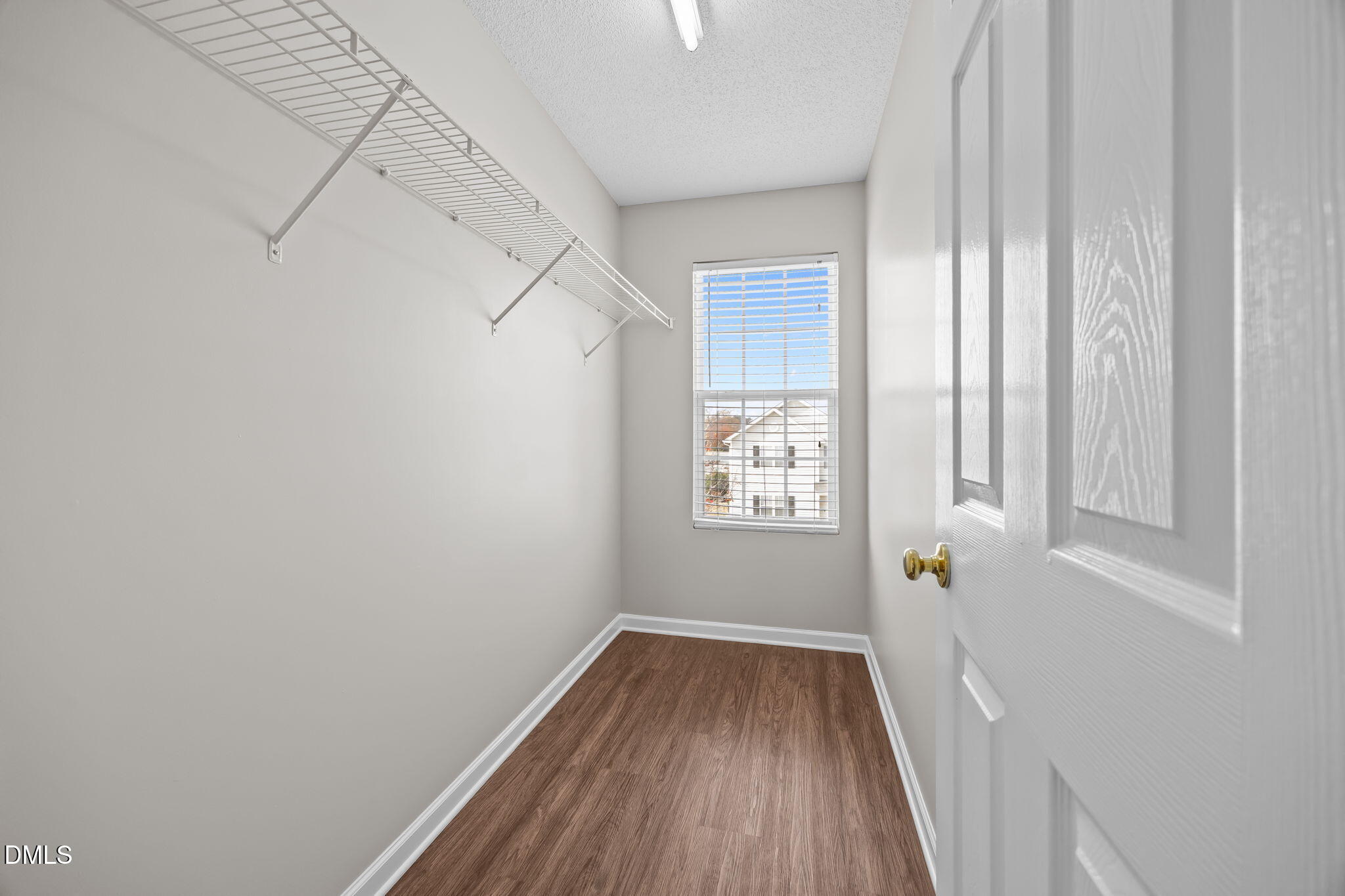 4406 Snowcrest Lane Raleigh, NC 27616 - Photo 25 of 41 a view of a room with wooden floor and windows