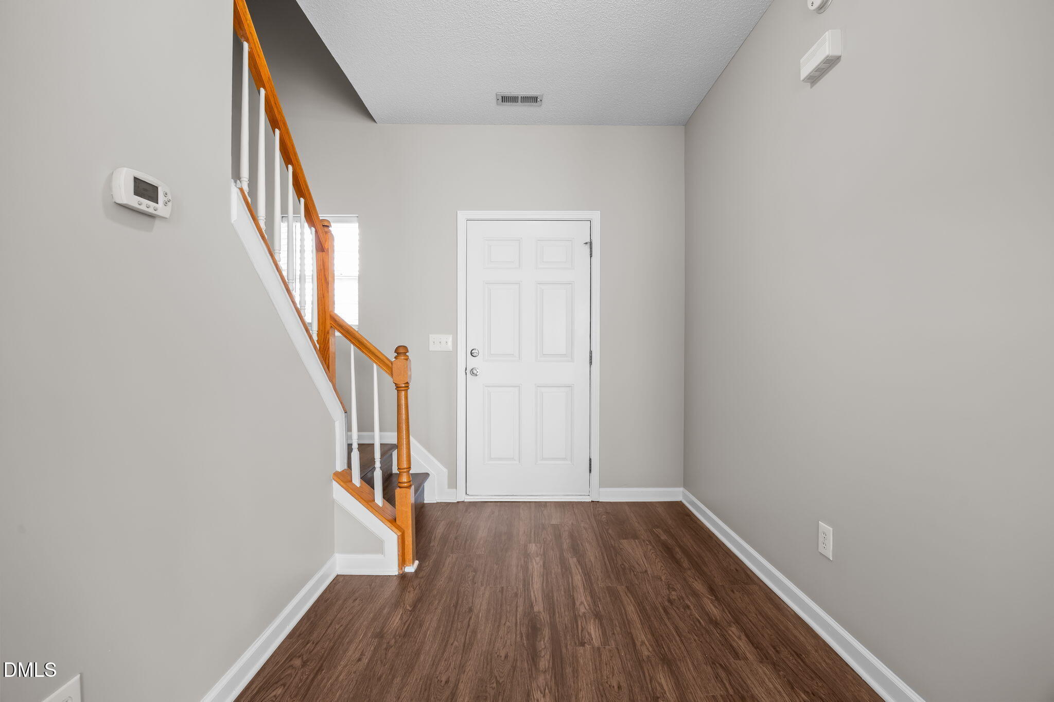 4406 Snowcrest Lane Raleigh, NC 27616 - Photo 6 of 41 a view of entryway with wooden floor