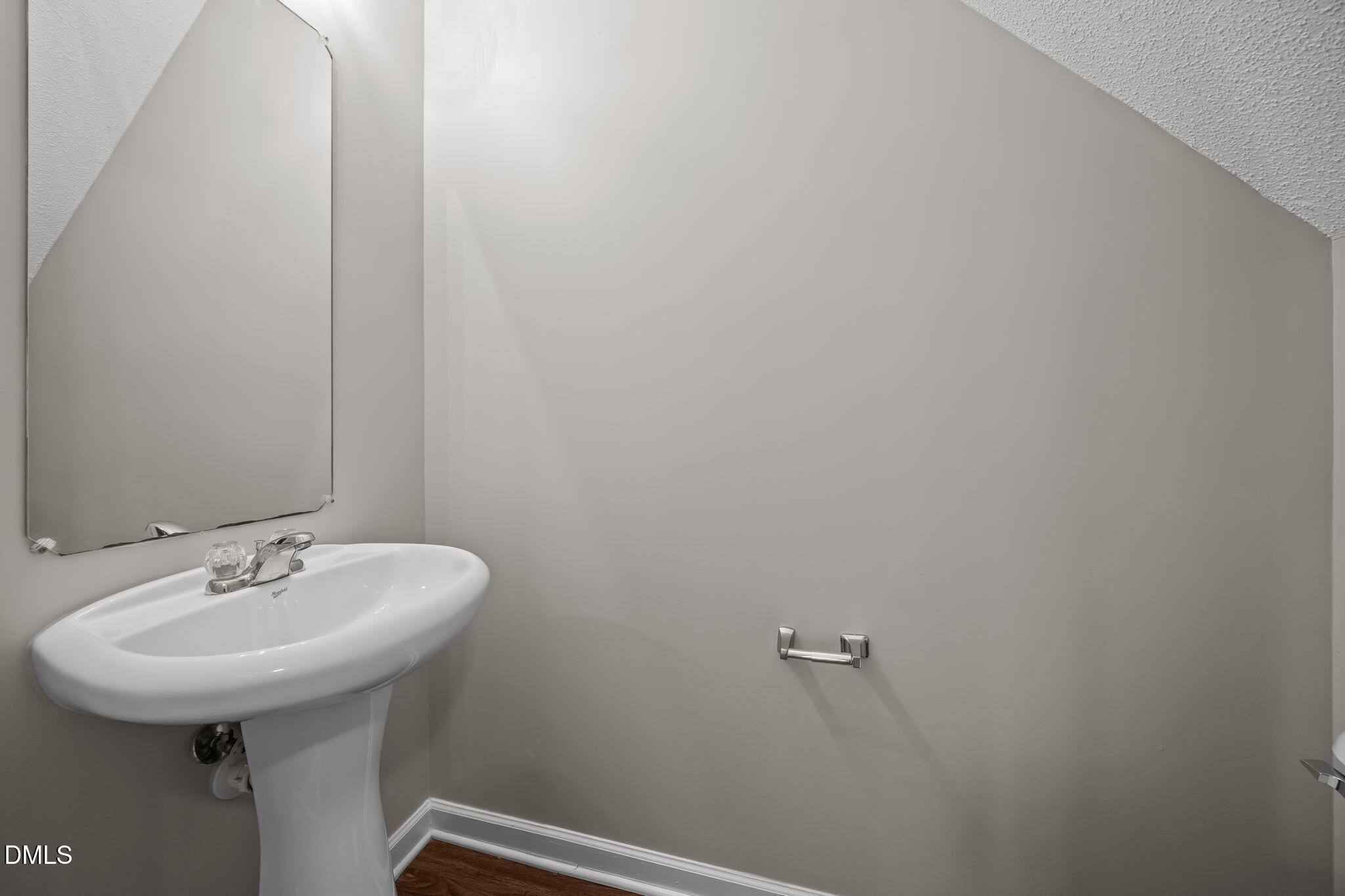 4406 Snowcrest Lane Raleigh, NC 27616 - Photo 7 of 41 a bathroom with a sink and mirror
