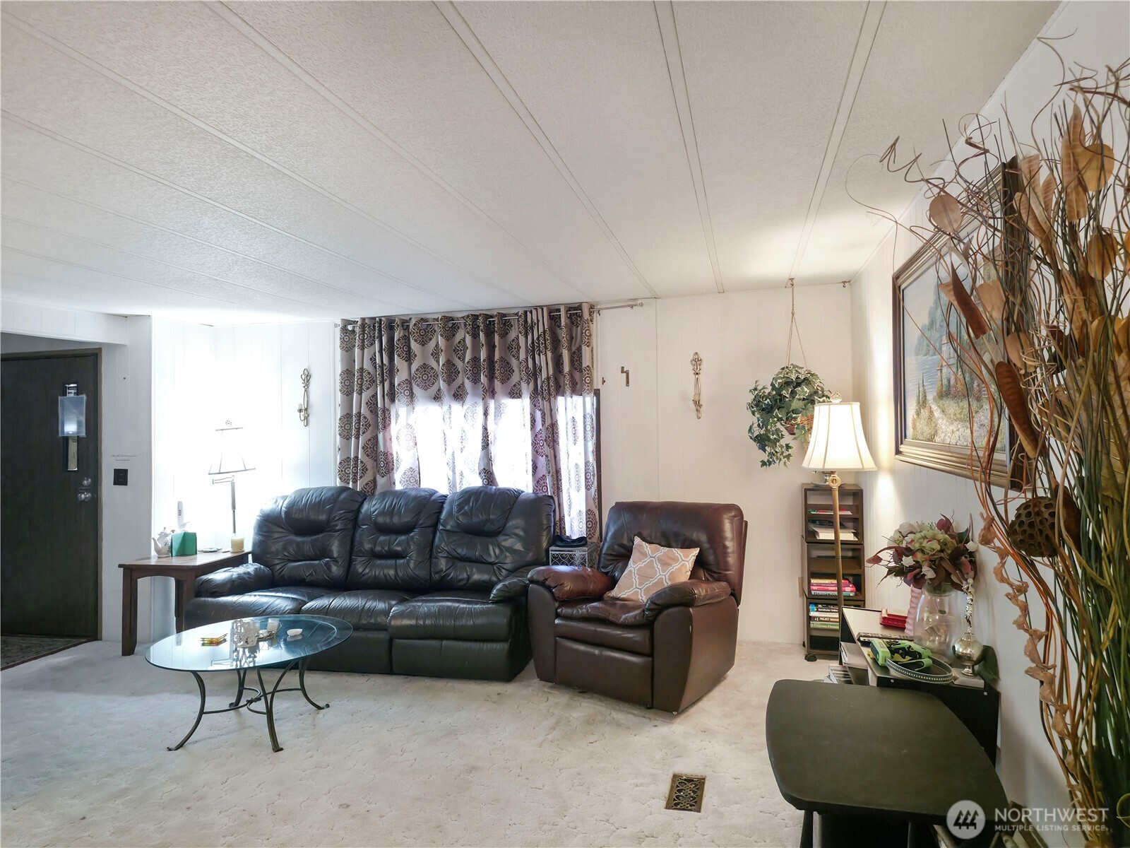 201 Union Avenue Southeast, Unit 192 Renton, WA 98059 - Photo 4 of 8 a living room with furniture and a large window