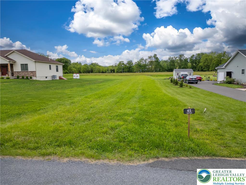 61 Labar Road Bangor, PA 18013 - Photo 2 of 5 a view of a patio with table and chairs with wooden fence