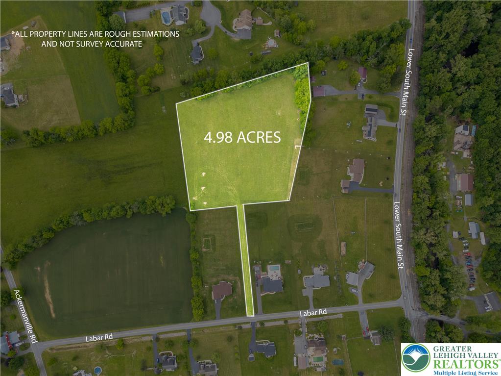 61 Labar Road Bangor, PA 18013 - Photo 4 of 5 a sign that is sitting on a lake