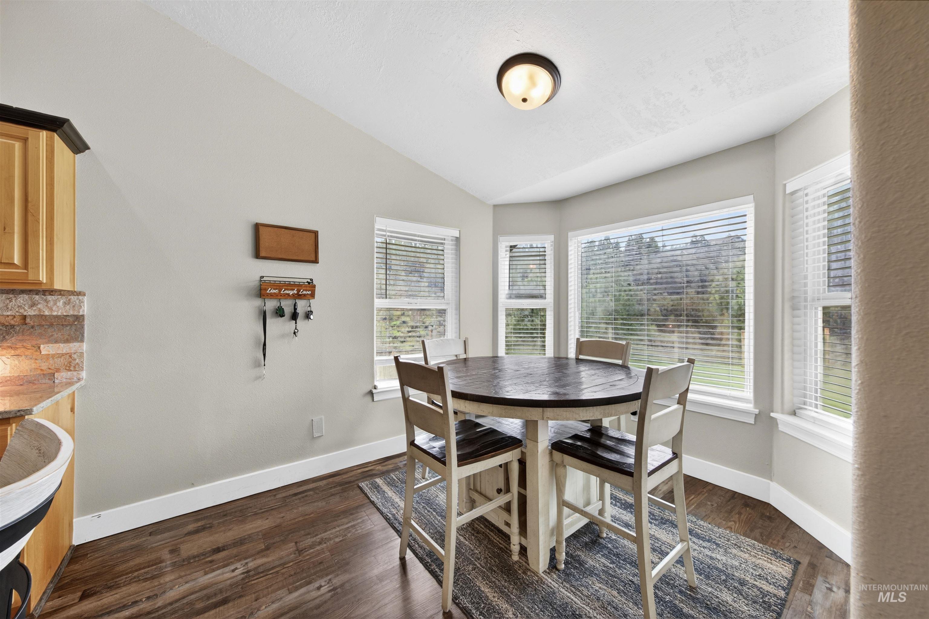 4 Round Up Circle Boise, ID 83716 - Photo 15 of 47 Bay window dining area featuring wood-finish flooring