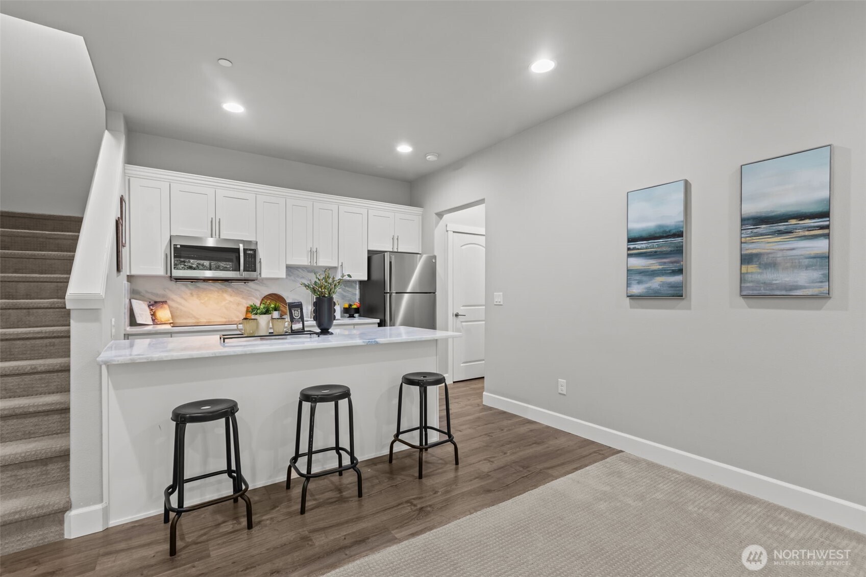 18231 3rd Drive Southeast Bothell, WA 98012 - Photo 32 of 40 a kitchen with stainless steel appliances granite countertop a refrigerator a stove top oven a sink dishwasher and wooden floor