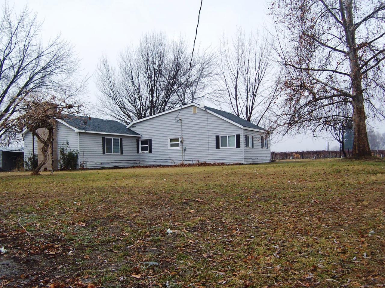 1191 Vance Road Mabton, WA 98935 - Photo 1 of 5 a view of a house with a yard