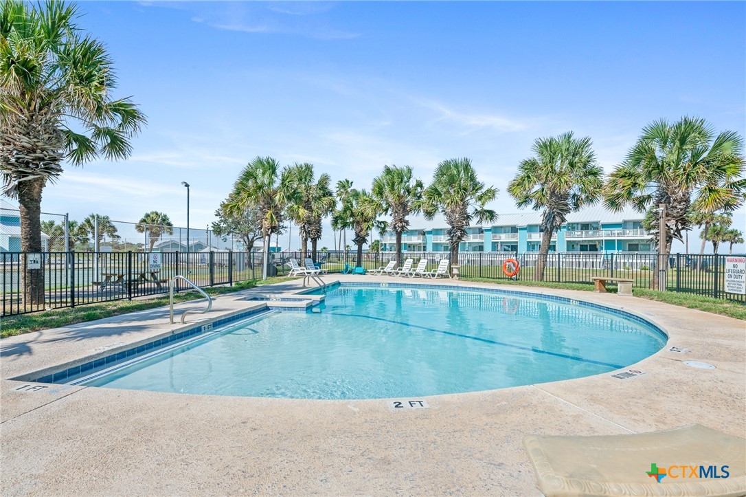 2292 North Fulton Beach Road, Unit 702 Rockport, TX 78382 - Photo 42 of 47 a view of outdoor space with swimming pool and seating