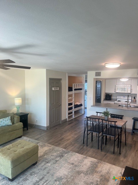 2292 North Fulton Beach Road, Unit 702 Rockport, TX 78382 - Photo 6 of 47 a living room with furniture and a wooden floor