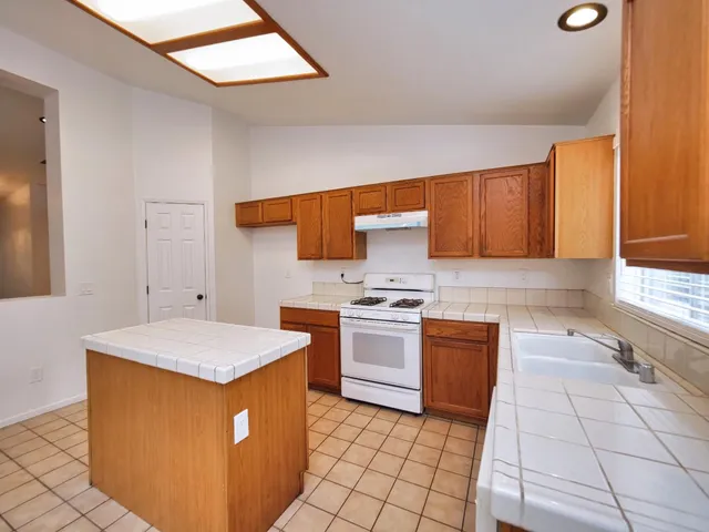 a bathroom with a bathtub sink and mirror