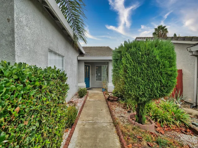 a view of a kitchen with a sink and a chandelier