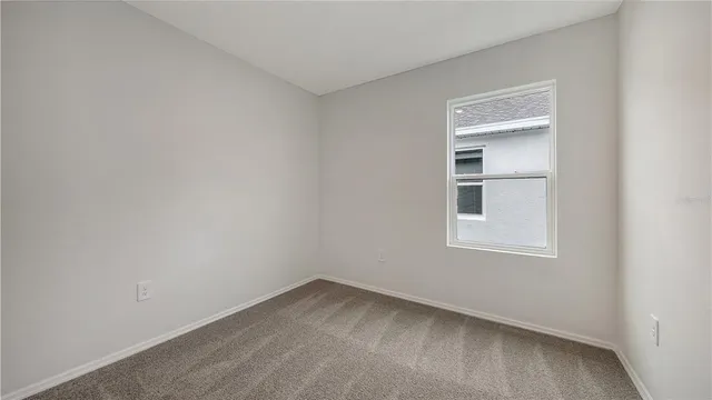 a view of empty room with windows