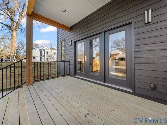 a view of a balcony with wooden floor