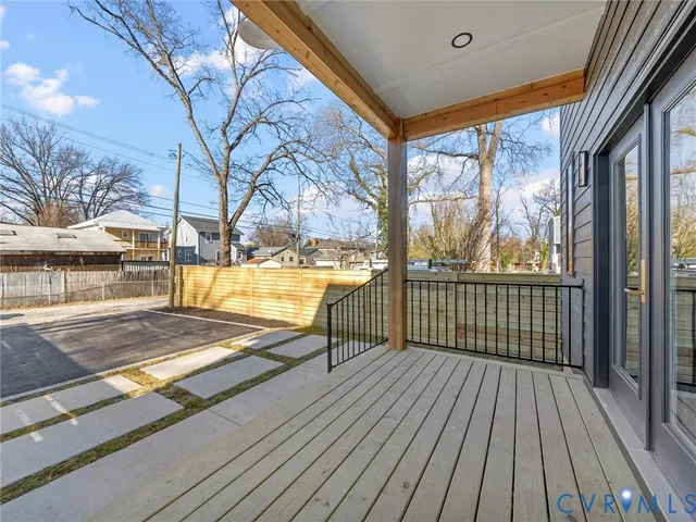 a view of a balcony with wooden floor