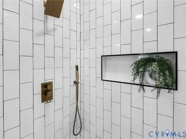 a bathroom with a bathtub and shower