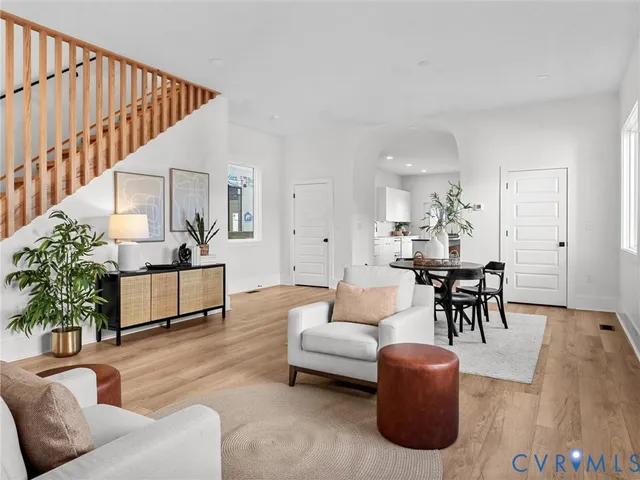 a living room with furniture and a table