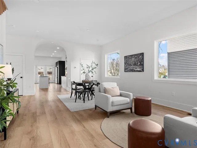 a living room with furniture and a table