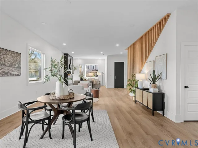 a view of a dining room with furniture window and wooden floor