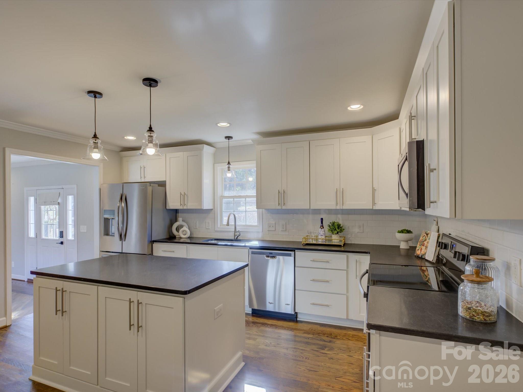 204 West Elliott Street Fort Mill, SC 29715 - Photo 12 of 43 a kitchen with a sink stove and cabinets