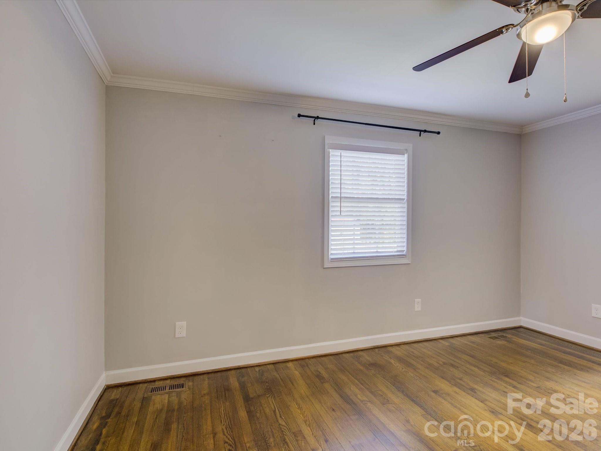 204 West Elliott Street Fort Mill, SC 29715 - Photo 18 of 43 wooden floor in an empty room with a window