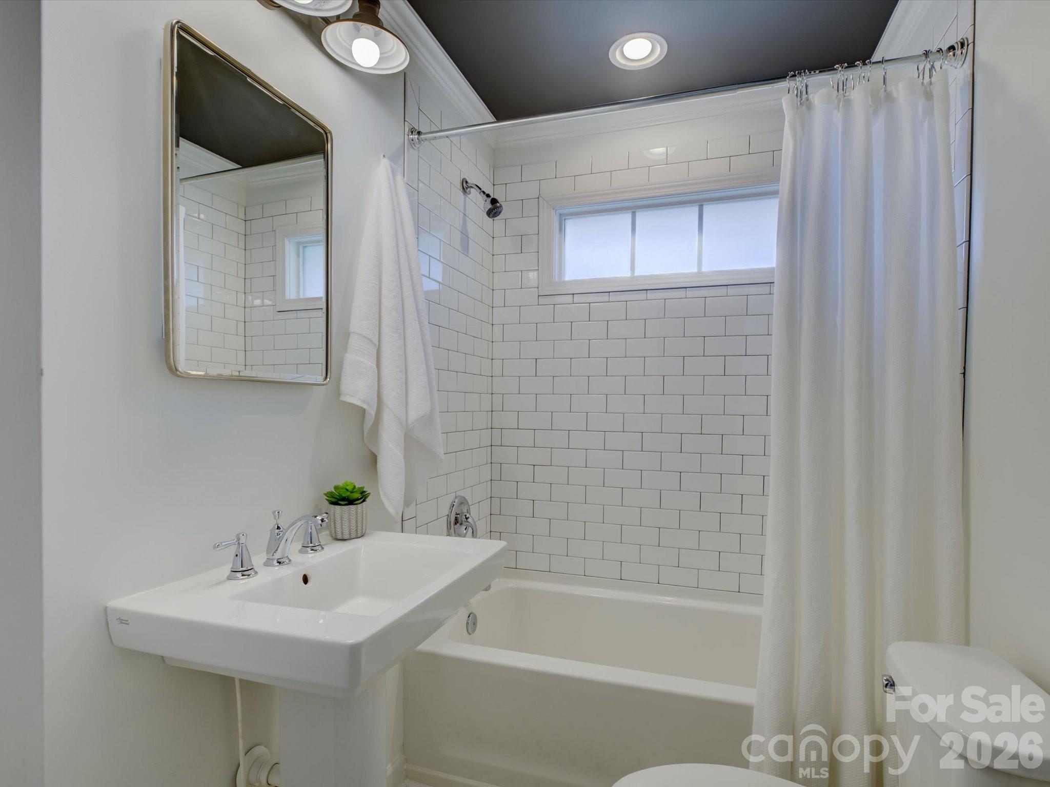 204 West Elliott Street Fort Mill, SC 29715 - Photo 26 of 43 a bathroom with a sink a toilet and shower