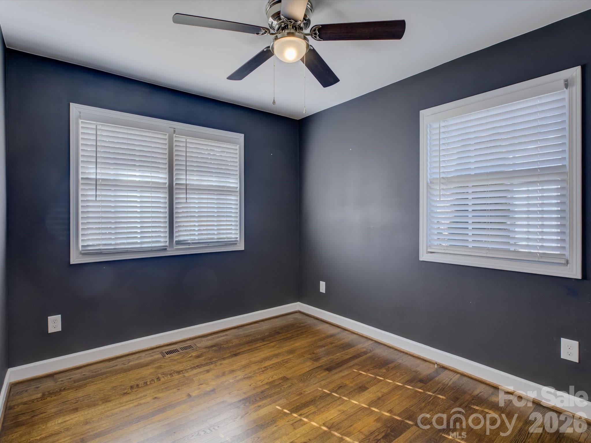 204 West Elliott Street Fort Mill, SC 29715 - Photo 27 of 43 a view of an empty room with window and chandelier fan