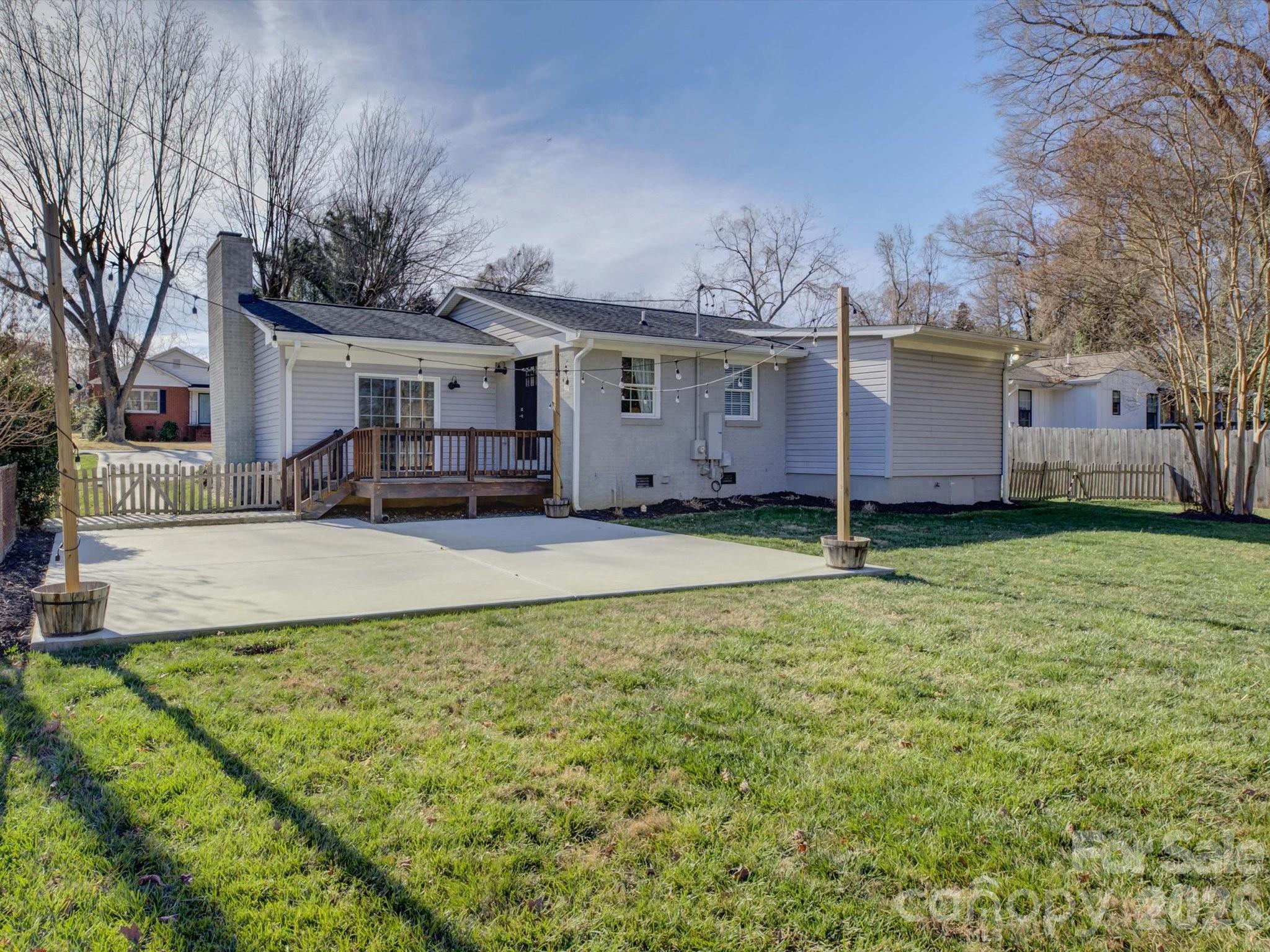 204 West Elliott Street Fort Mill, SC 29715 - Photo 30 of 43 a view of a house with a yard and large trees