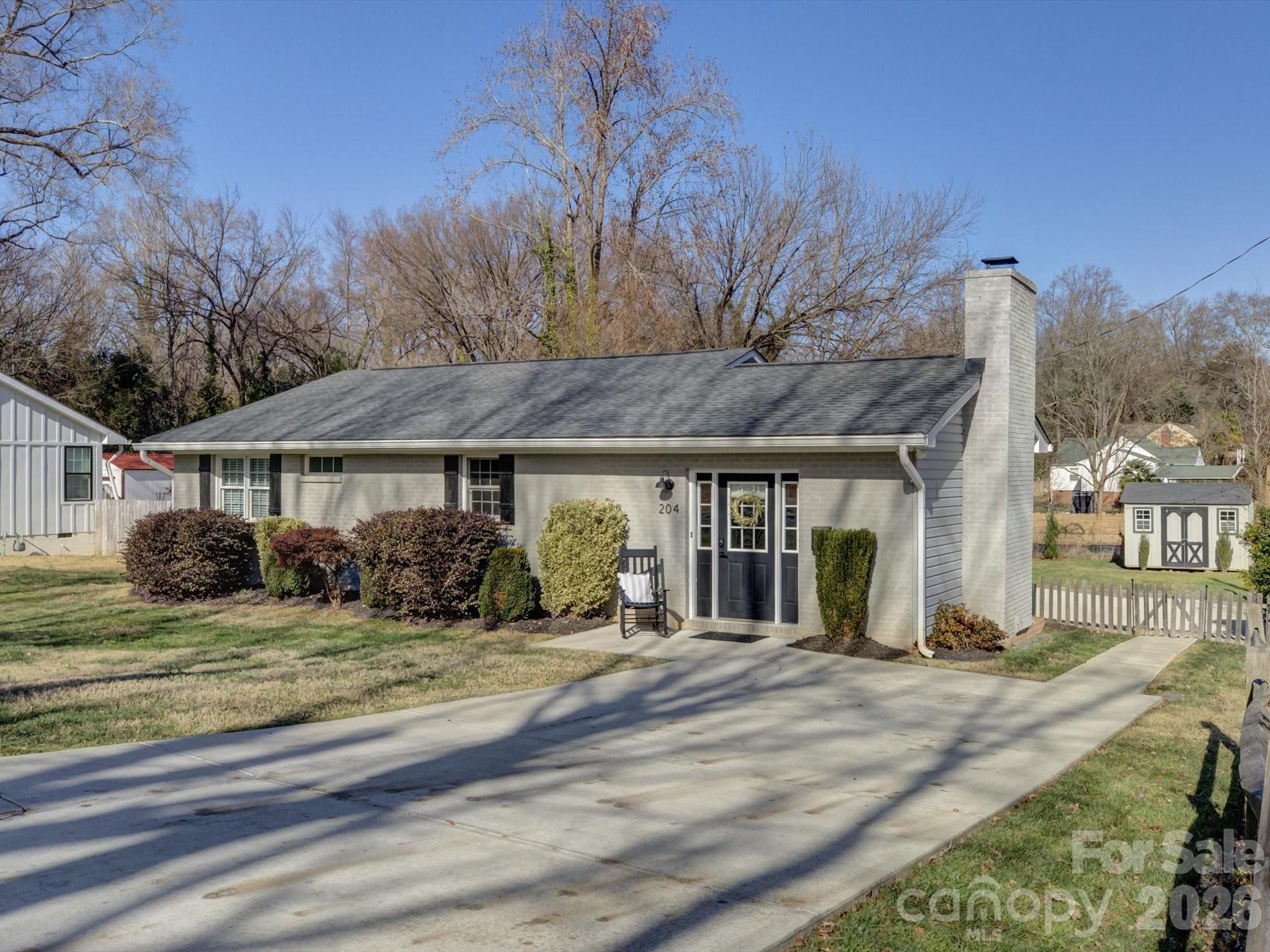 204 West Elliott Street Fort Mill, SC 29715 - Photo 3 of 43 a front view of a house with a yard
