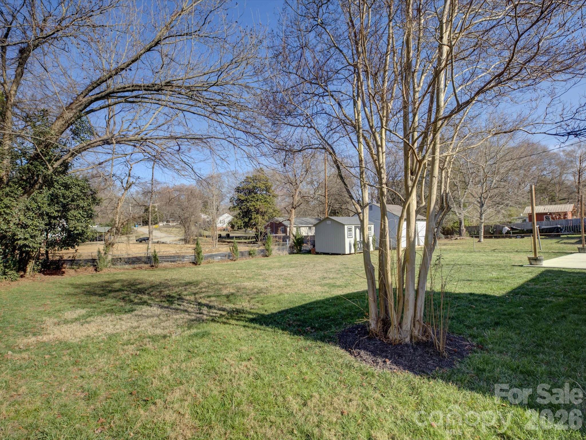 204 West Elliott Street Fort Mill, SC 29715 - Photo 33 of 43 a view of a yard with an trees