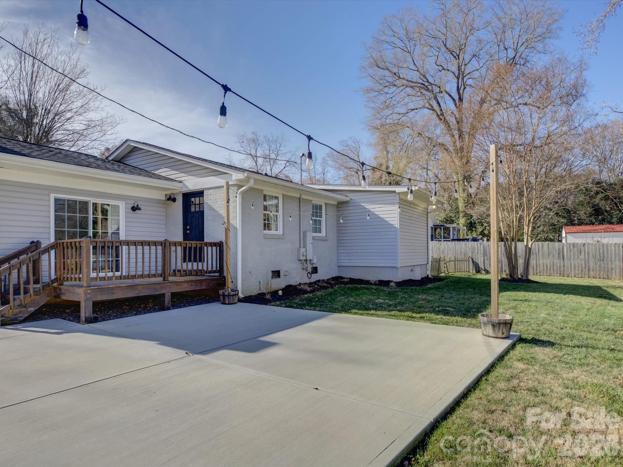 204 West Elliott Street Fort Mill, SC 29715 - Photo 35 of 43 a backyard of a house with barbeque oven and outdoor seating
